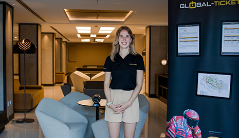 Travel guide welcoming guests at the hotel info desk