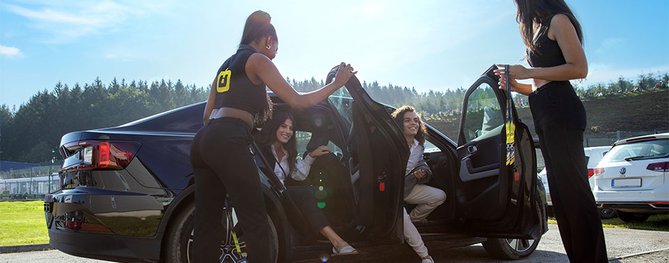 Guests being welcomed by staff at event drop-off area