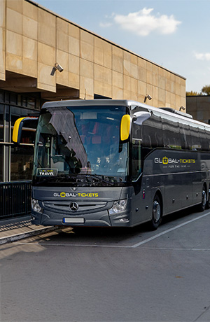 Global-Tickets branded travel bus parked at event location
