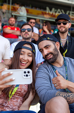 Fans taking a selfie at a motorsport event